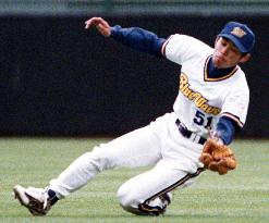 Ichiro Suzuki makes a sliding catch in the game against the Chiba Lotte Marines in  Kobe Green Stadium.